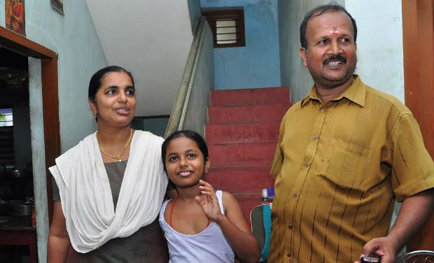 Sandhaya, who fought with LDF activists against their seige at Cliff House on Thursday, with her husband and daughter, at her rented house in Thiruvananthapuram. DC/Peethambaran Payyeri Sandhaya, who fought with LDF activists against their seige at Cliff House on Thursday, with her husband and daughter, at her rented house in Thiruvananthapuram. DC/Peethambaran Payyeri